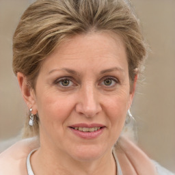 Joyful white adult female with medium  brown hair and grey eyes