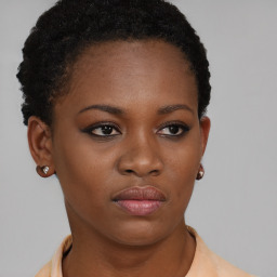 Neutral black young-adult female with short  brown hair and brown eyes