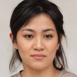 Joyful asian young-adult female with medium  brown hair and brown eyes