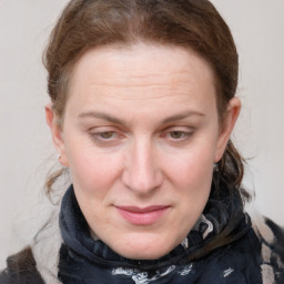 Joyful white adult female with medium  brown hair and grey eyes