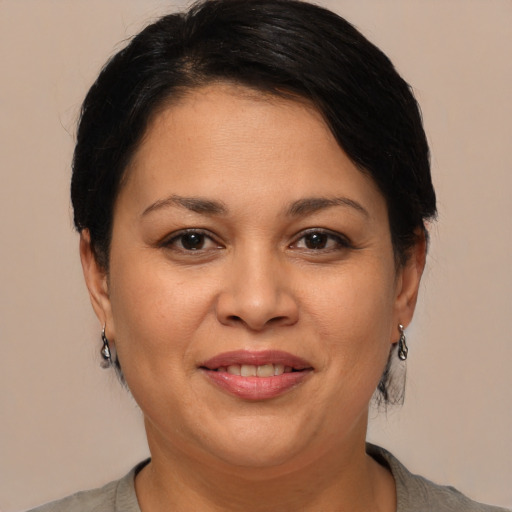 Joyful white adult female with short  brown hair and brown eyes