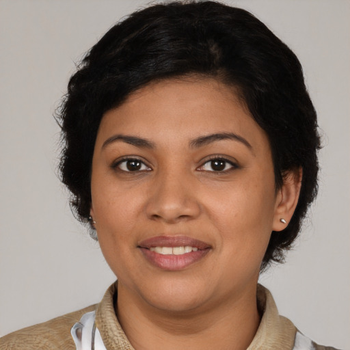 Joyful latino young-adult female with short  brown hair and brown eyes