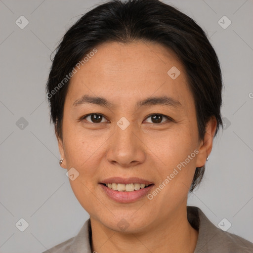 Joyful asian adult female with medium  brown hair and brown eyes