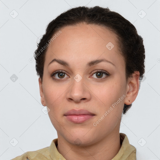 Joyful latino young-adult female with short  brown hair and brown eyes