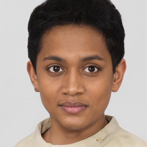 Joyful black young-adult female with short  black hair and brown eyes
