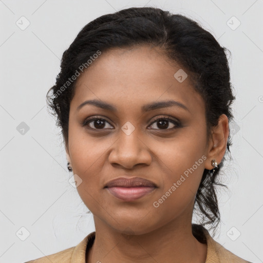 Joyful black young-adult female with long  brown hair and brown eyes