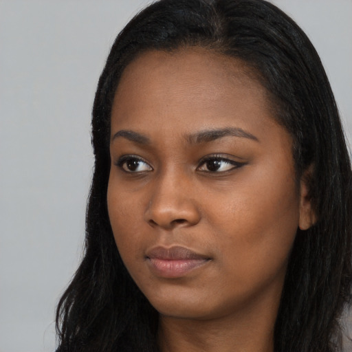 Neutral black young-adult female with long  black hair and brown eyes