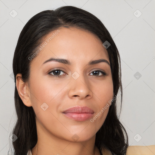 Joyful latino young-adult female with long  black hair and brown eyes