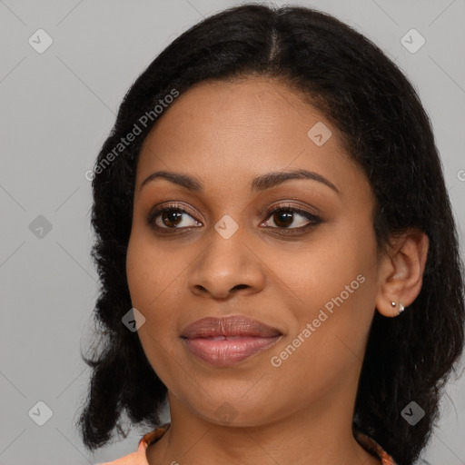 Joyful black young-adult female with medium  brown hair and brown eyes