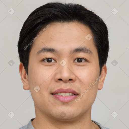 Joyful asian young-adult male with short  brown hair and brown eyes