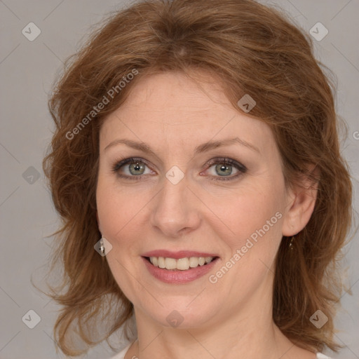 Joyful white adult female with medium  brown hair and grey eyes