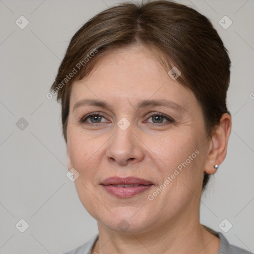 Joyful white adult female with short  brown hair and grey eyes