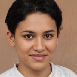 Joyful latino young-adult female with short  brown hair and brown eyes