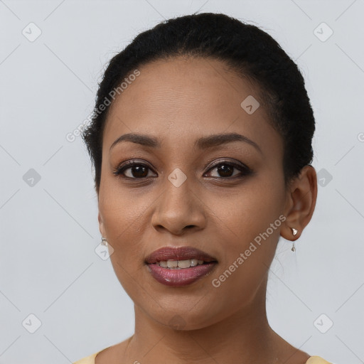 Joyful latino young-adult female with short  black hair and brown eyes