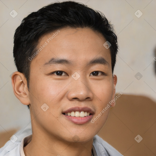 Joyful asian young-adult male with short  brown hair and brown eyes