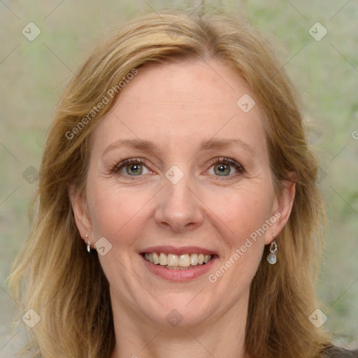 Joyful white adult female with long  brown hair and green eyes