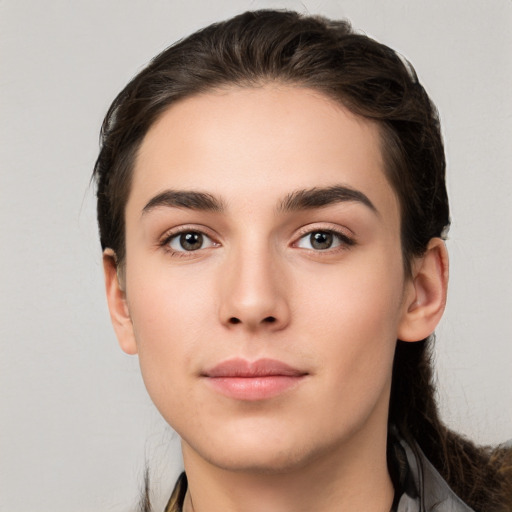 Neutral white young-adult female with long  brown hair and brown eyes