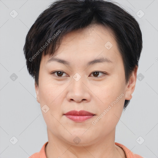 Joyful asian young-adult female with short  brown hair and brown eyes