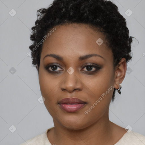 Joyful black young-adult female with short  brown hair and brown eyes