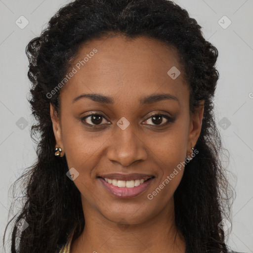 Joyful black young-adult female with long  brown hair and brown eyes