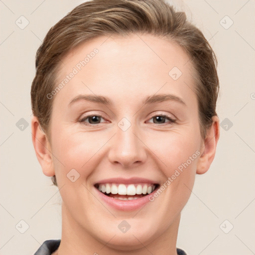 Joyful white young-adult female with short  brown hair and grey eyes