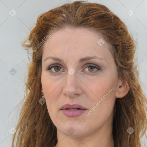 Joyful white adult female with long  brown hair and brown eyes