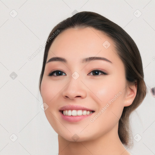 Joyful white young-adult female with medium  black hair and brown eyes