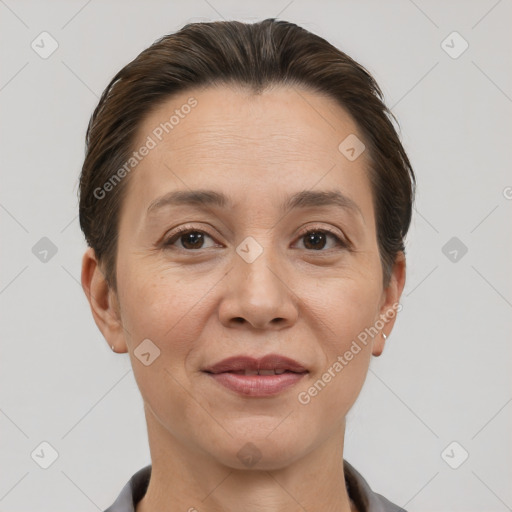 Joyful white adult female with short  brown hair and brown eyes