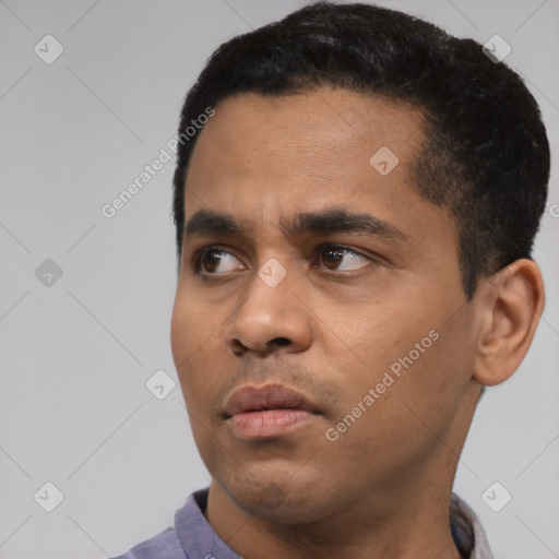 Neutral latino young-adult male with short  black hair and brown eyes