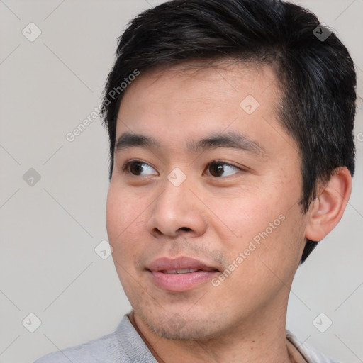 Joyful white young-adult male with short  black hair and brown eyes