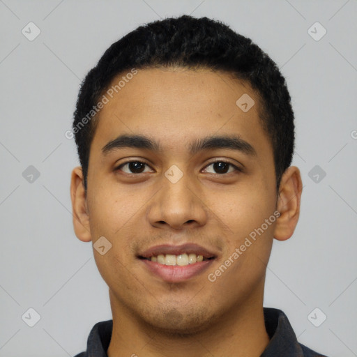 Joyful latino young-adult male with short  black hair and brown eyes