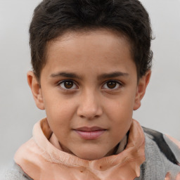 Joyful white child male with short  brown hair and brown eyes