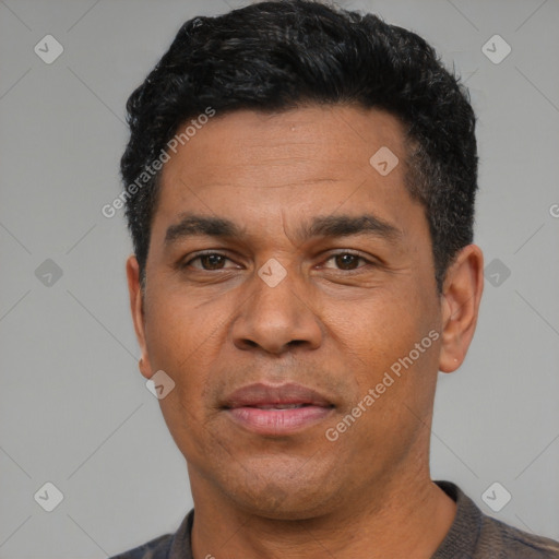 Neutral latino adult male with short  black hair and brown eyes