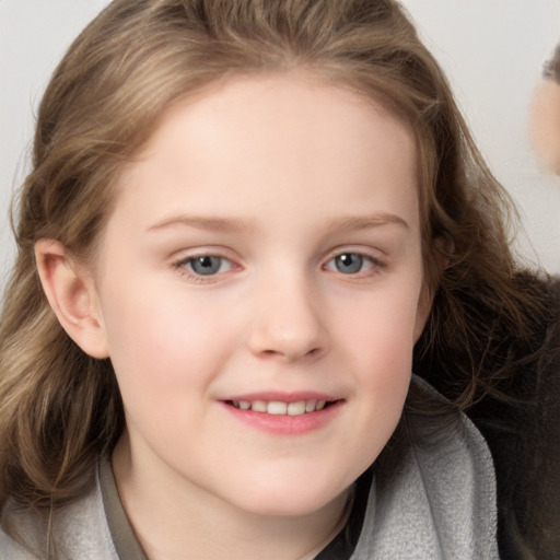 Joyful white child female with medium  brown hair and grey eyes