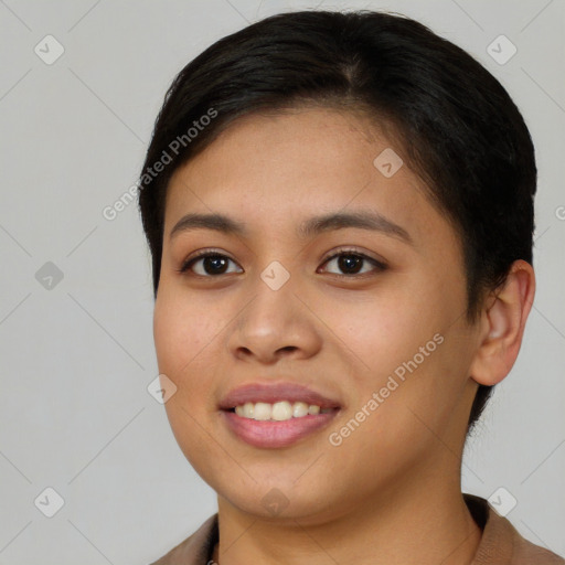 Joyful asian young-adult female with short  brown hair and brown eyes