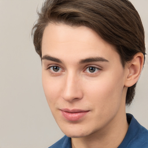 Joyful white young-adult male with medium  brown hair and brown eyes