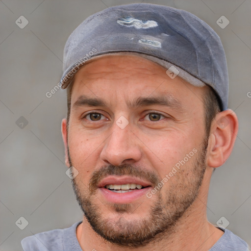 Joyful white adult male with short  brown hair and brown eyes