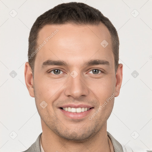 Joyful white young-adult male with short  brown hair and brown eyes