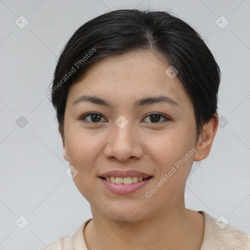 Joyful asian young-adult female with short  brown hair and brown eyes