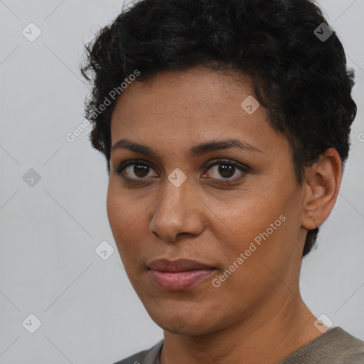 Joyful latino young-adult female with short  brown hair and brown eyes