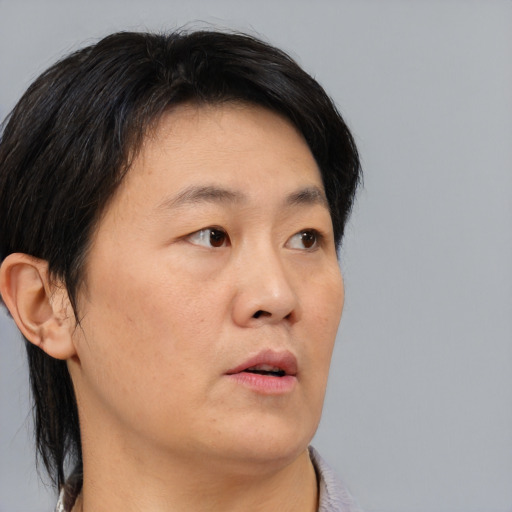 Neutral asian adult male with short  black hair and brown eyes