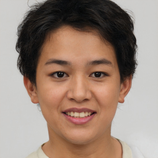 Joyful asian young-adult female with short  brown hair and brown eyes