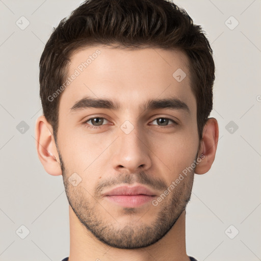 Neutral white young-adult male with short  brown hair and brown eyes