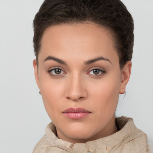 Neutral white young-adult female with short  brown hair and brown eyes