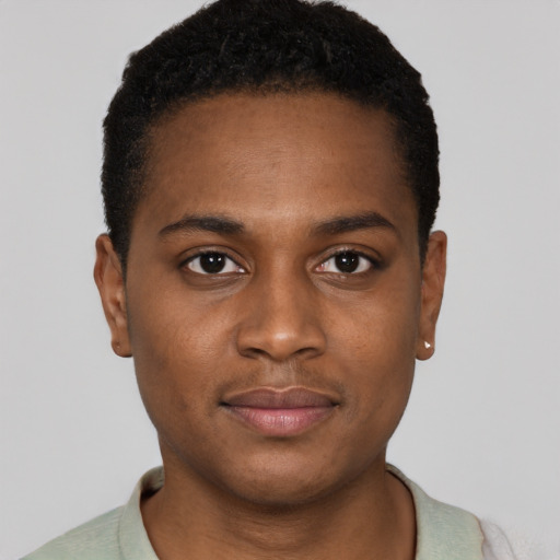 Joyful black young-adult male with short  brown hair and brown eyes