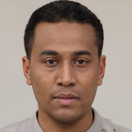 Neutral black young-adult male with short  black hair and brown eyes