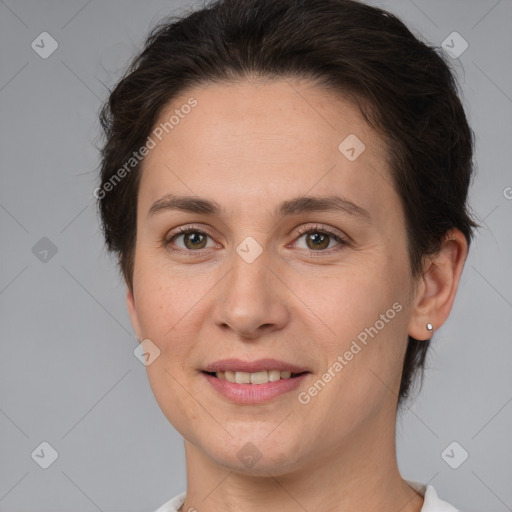 Joyful white adult female with short  brown hair and brown eyes