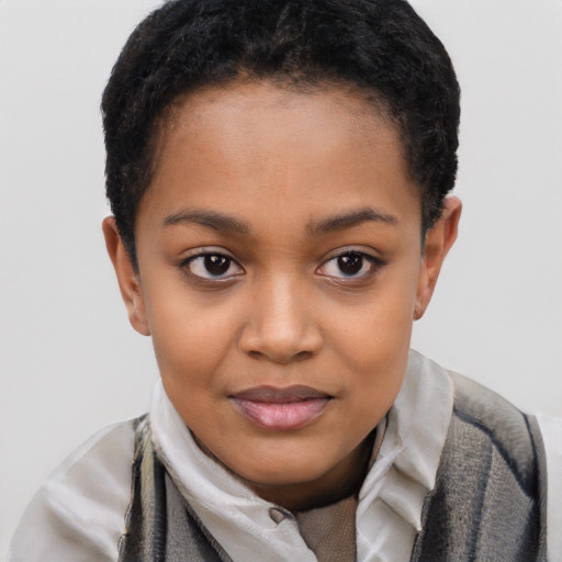 Joyful black child female with short  brown hair and brown eyes