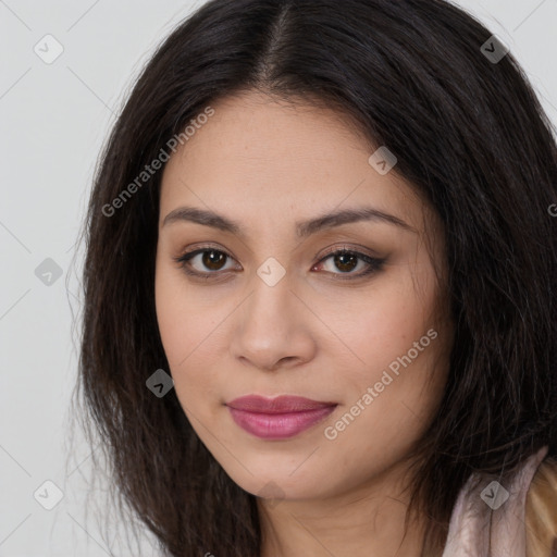 Joyful latino young-adult female with long  brown hair and brown eyes