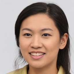 Joyful asian young-adult female with medium  brown hair and brown eyes